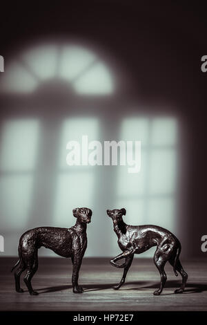 Pair of antique bronze greyhound dog figures Stock Photo