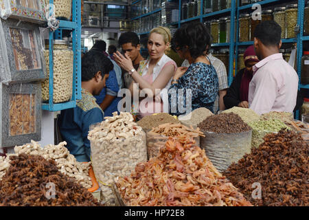 Kochi, India - November 6, 2015 - Clients bargaining and buying fresh spices in indian shop Stock Photo