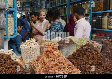 Kochi, India - November 6, 2015 - Clients bargaining and buying fresh spices in indian shop Stock Photo