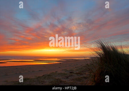 Sunrise along the north Norfolk coast at the beach by Burnham Overy Dunes in June Stock Photo