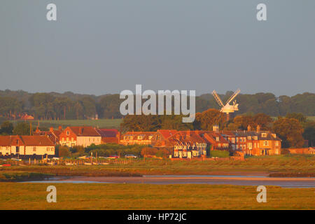 The village of Burnham Overy Staithe in North Norfolk at sunrise in summer as viewed from Gun Hill Stock Photo