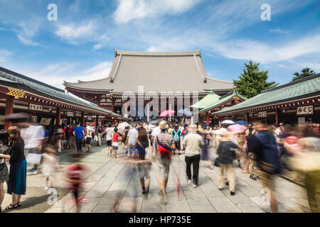 TOKYO, JAPAN - AUGUST 24, 2015: People, captured with blurred motion, visit the famous Senso-ji Buddhist temple in Asakusa historic district of Tokyo, Stock Photo