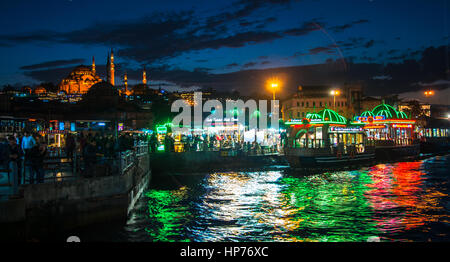 Istanbul, Turkey – March  20, 2015: Cooked fish and bread sold in boat Stock Photo