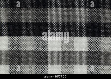 Black, white and gray tablecloth picnic texture and structure background macro photo close up in studio. Stock Photo