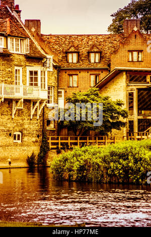 Old historic manor house on the river banks in Cambridge