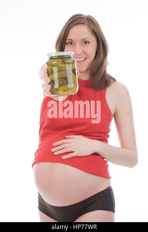 Model released, Schwangere Frau mit Essiggurken - pregnant woman with gherkins Stock Photo