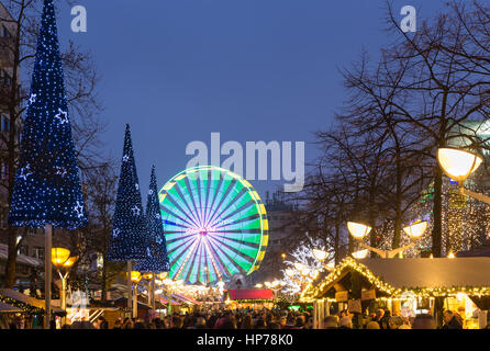 DUISBURG, GERMANY - DECEMBER 17, 2016: Traditional christmas market with illuminated ferris wheel in the center of Duisburg, Germany Stock Photo