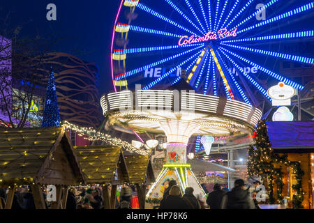 DUISBURG, GERMANY - DECEMBER 17, 2016: Traditional christmas market with illuminated carrousel and ferris wheel in the center of Duisburg, Germany Stock Photo