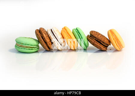Stack of multicolour macaroon biscuits isolated on white. Stock Photo