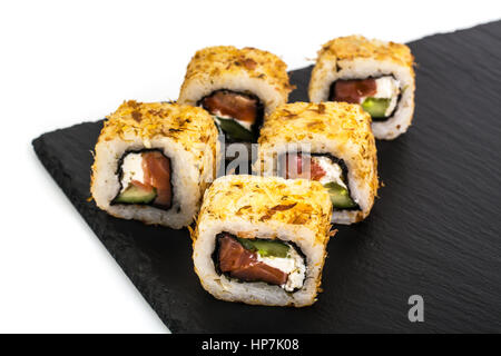 Original sushi rolls on black stone. Studio Photo Stock Photo