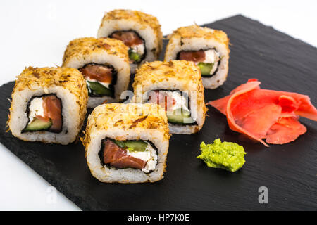 Original sushi rolls on black stone. Studio Photo Stock Photo