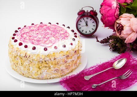Sponge cake with almonds, whipped cream and berries. Studio Photo Stock Photo