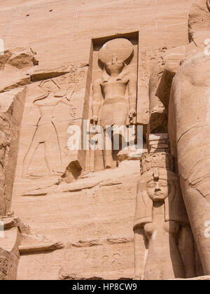 Statue of the falcon god Horus with a sun disc on his head at the Temple of Ramesses II, Abu Simbel, Egypt Stock Photo