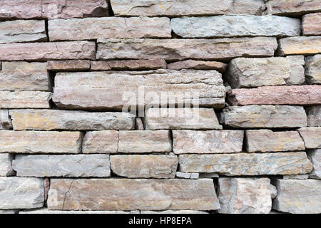 Closeup of a gray limestone brick wall Stock Photo