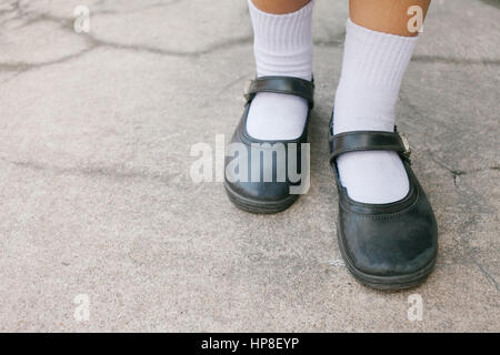 Thai girl Student shoes at concrete background Stock Photo