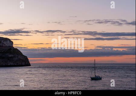 Sunset from the pier at Llandudno with the great Orme on the Left Stock Photo