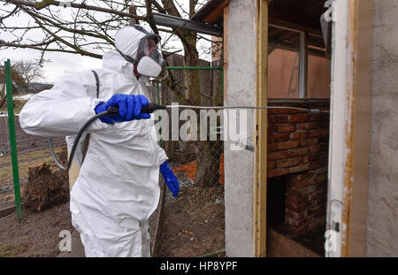 Ivancice, Czech Republic. 18th Feb, 2017. The specialists deep clean and disinfect bird flu epicentre in Ivancice, Czech Republic, on Saturday, February 18, 2017. Bird flu has spread to many European countries, including Slovakia. The virus of the H5 type is highly contagious for birds but, according to current information, is not dangerous for people. Credit: Lubos Pavlicek/CTK Photo/Alamy Live News Stock Photo