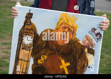 London, UK. 20th Feb, 2017. Political artist Kaya Mar holds up an oil painting of Donald Trump and HM The Queen. Hundreds of protesters gather in a flag flash-mob in Parliament Square to show solidarity with migrants. Over three million migrants live in the UK and face an uncertain future post Brexit. Credit: Bettina Strenske/Alamy Live News Stock Photo