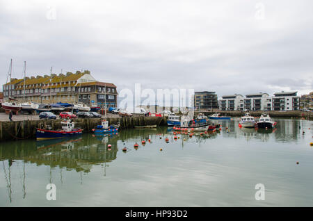 West Bay, Dorset, UK. 20th Feb, 2017. Work begins at West Bay Harbour in Dorset to repair and strengthen the historic harbour walls which have become weak and on the verge of collapse. West Bay has become famous for its starring roll in the hit ITV series Broadchurch, which is due to be aired on tv again on Monday 28th February 2017. Picture Credit: Graham Hunt/Alamy Live News Stock Photo