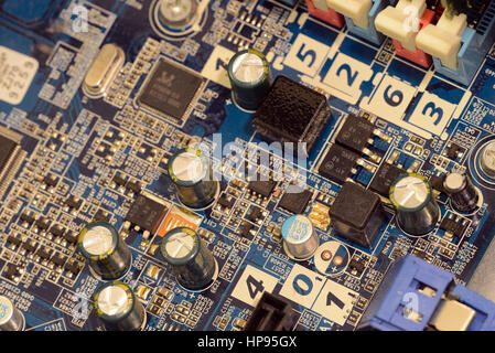 Close up of printed circuits on motherboard, the backbone of center of electrical connectivity for computer hardware and microcomputer systems includi Stock Photo