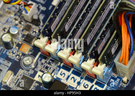 Close up of printed circuits on motherboard, the backbone of center of electrical connectivity for computer hardware and microcomputer systems includi Stock Photo