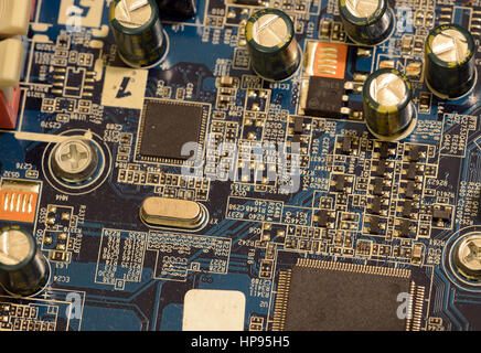 Close up of printed circuits on motherboard, the backbone of center of electrical connectivity for computer hardware and microcomputer systems includi Stock Photo