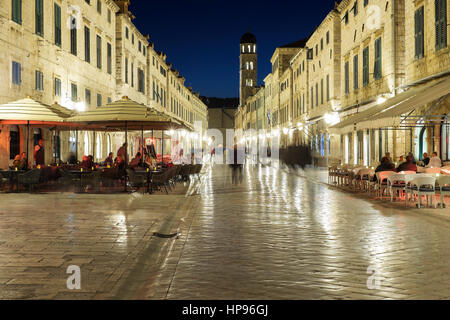 People alfresco dining near the bell-tower, Luza Square, Stradum (Placa), early evening, Dubrovnik, Croatia Stock Photo