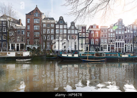 Amsterdam, has more than one hundred kilometers of canals, about 90 islands and 1,500 bridges. The three main canals, Herengracht, Prinsengracht, and  Stock Photo