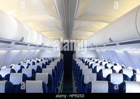 https://l450v.alamy.com/450v/hp9g5d/empty-cabin-of-airplane-with-blue-seats-and-white-panel-hp9g5d.jpg