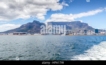 Leaving Table Bay and Table Mountain, Cape Town with wake on ocean Stock Photo