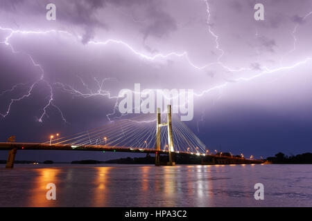 Lightning over the Great River Bridge and the Mississippi River during a severe storm in Burlington, Iowa Stock Photo
