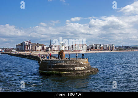 The Breakwater at the entrance to Ayr Harbour in Ayr Ayrshire Scotland UK and beach Stock Photo