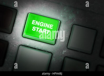 Button on a dirty old panel, selective focus - engine start Stock Photo