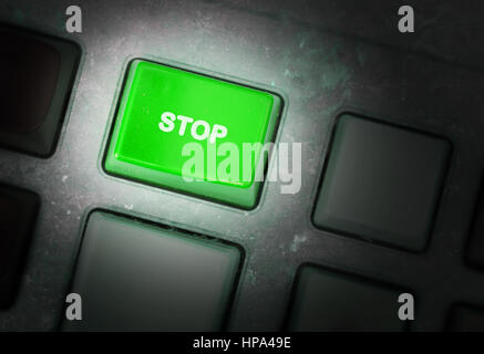 Button on a dirty old panel, selective focus - stop Stock Photo