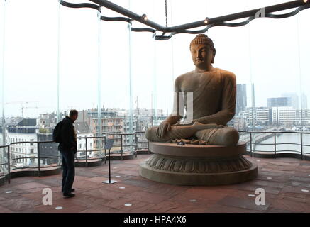 Interior of the MAS (Museum aan de Stroom) Museum, Antwerp, Belgium. Large Buddha Statue, Buddha and Mind exhibition Stock Photo