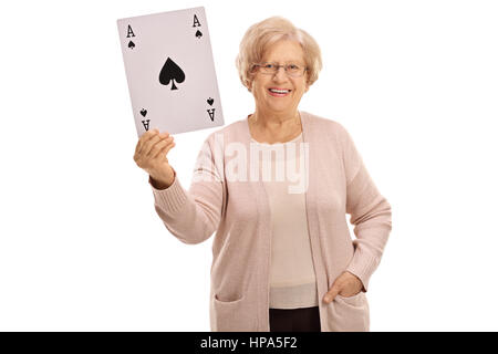 Happy mature woman showing an ace of spades card isolated on white background Stock Photo