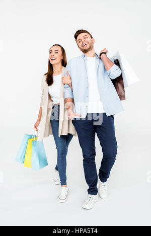 couple walking with shopping bags on white Stock Photo