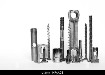 Screws and bolts, shiny metal tools isolated in front of white background Stock Photo