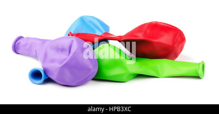 Deflated bright color empty balloons isolated on white background Stock Photo