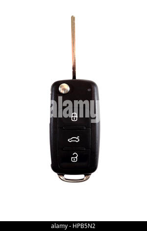 Black ignition key close-up. Black car key over white background. Stock Photo