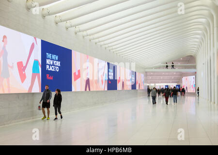 People walk through the West Concourse connecting the Oculus World Trade Center Transportation Hub and Brookfield Place in New York City. Stock Photo