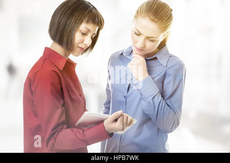 two business woman working together Stock Photo