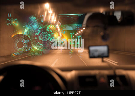 car driving through tunnel highway tunnel at night.car HUD dashboard. Futuristic user interface HUD and Infographic elements. Abstract virtual graphic Stock Photo