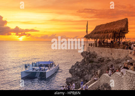 Ricks Cafe open air bar , Rick´s viewpoint at sunset, Catamaran, nightlife, Negril Jamaica, Stock Photo
