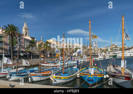 Mediterranean Fishing boats at Sanary-Sur-Mer , Promenade, Mistral Clouds, French Riviera,  Cote d Azur, France Stock Photo