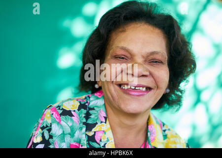 Old hispanic real people from Cuba with feelings and emotions, portrait of funny senior african american lady laughing and looking at camera. Elderly  Stock Photo
