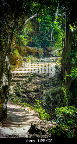 Stone staircase leading on Tembeling pool, Nusa Penida Bali Indonesia Stock Photo