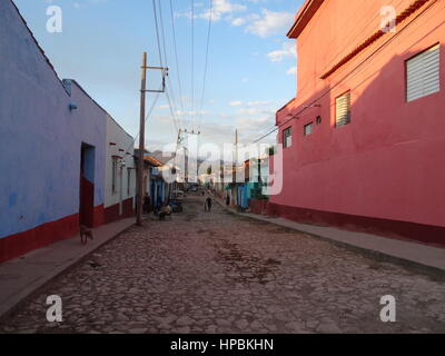 Street scene in Trinidad,Cuba cobbled street with colourful old colonial buildings at sunset Stock Photo