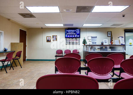 Florida South,Miami Beach,Social Security Office,federal government agency,waiting room,empty,information desk,adult adults man men male,agent,visitor Stock Photo
