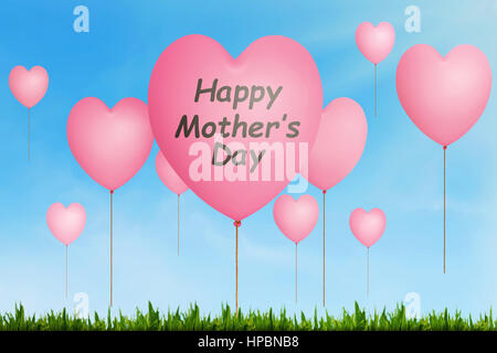 Happy Mothers Day message written on pink balloon with heart shape in the air Stock Photo